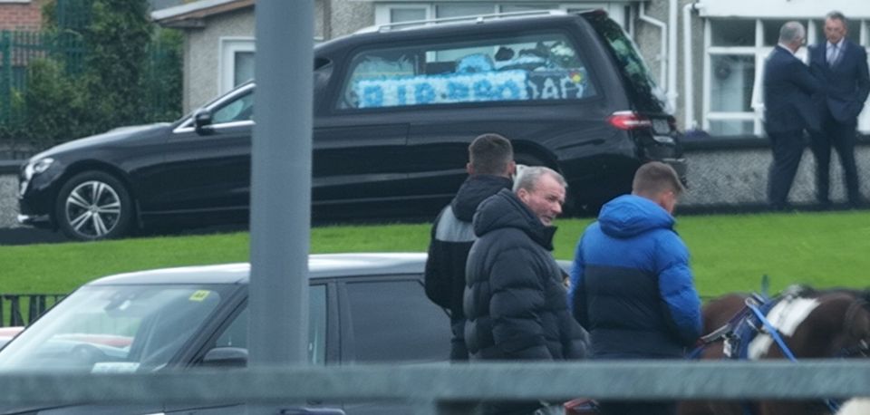 ‘Fat’ John McCarthy (centre) at Nolan’s funeral service